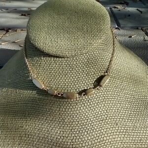 Women's gold tone choker chain necklace.